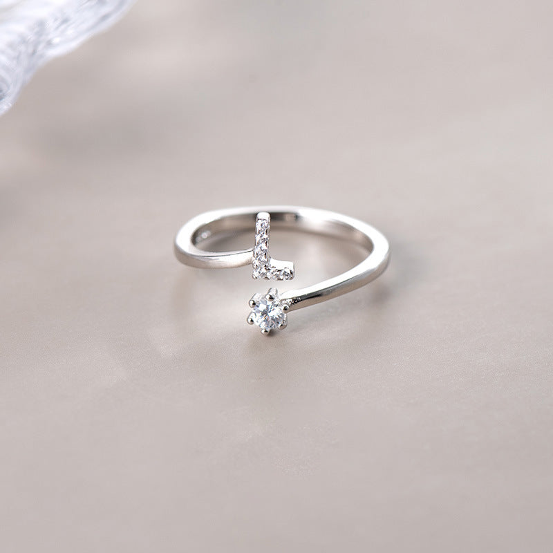 anel letra cravejada