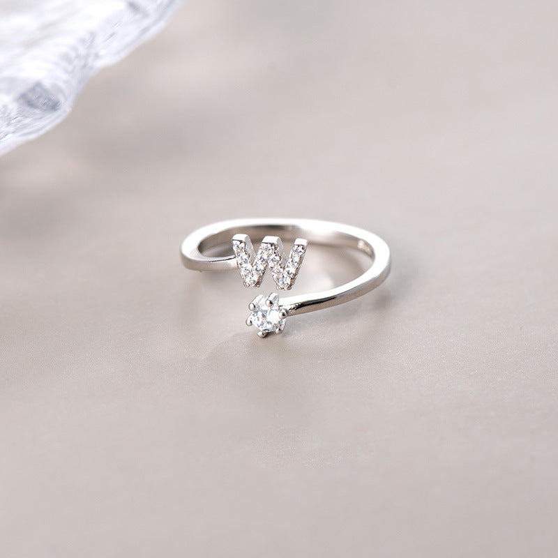 anel letra cravejada